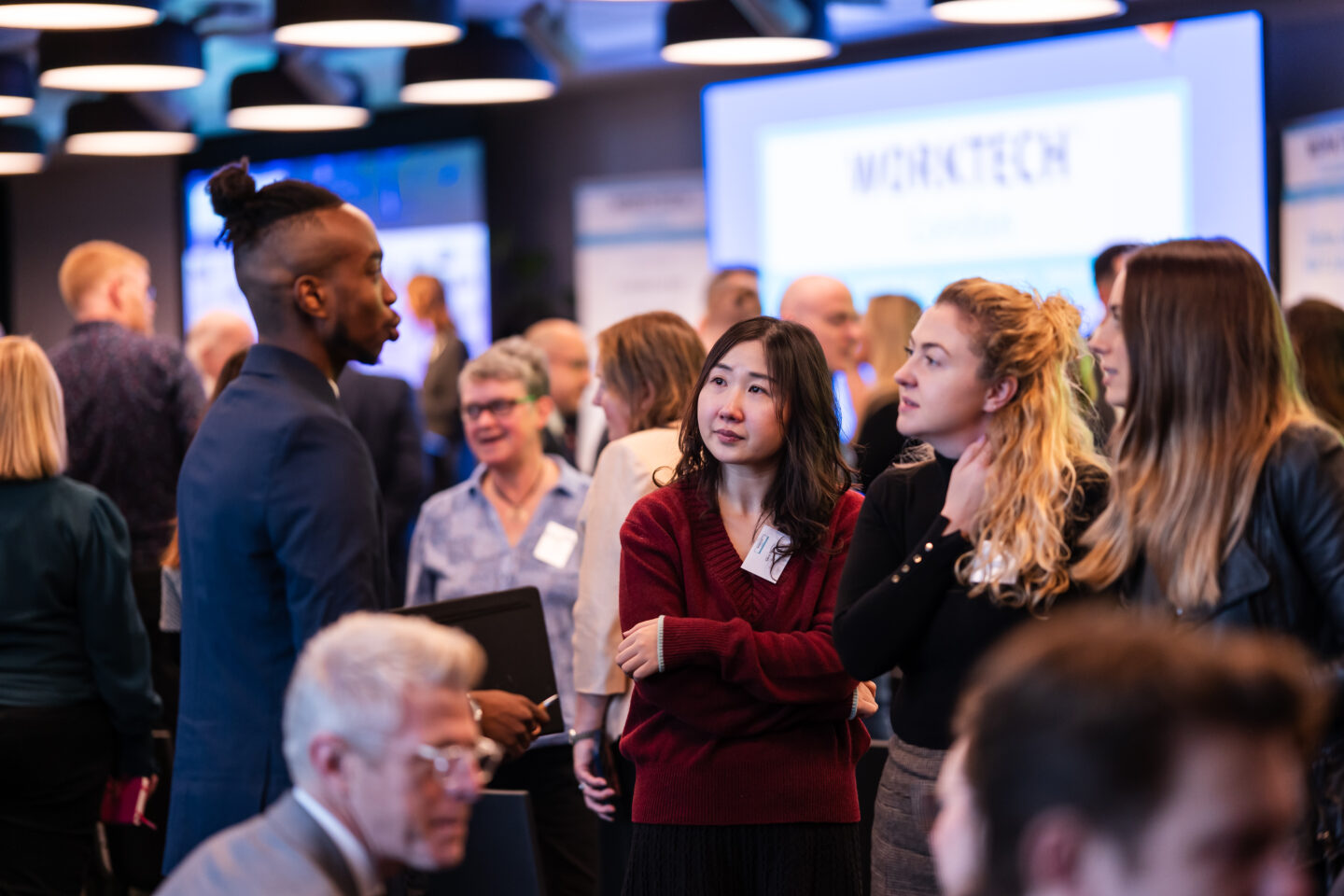 A mixed group of delegate attendees at a conference