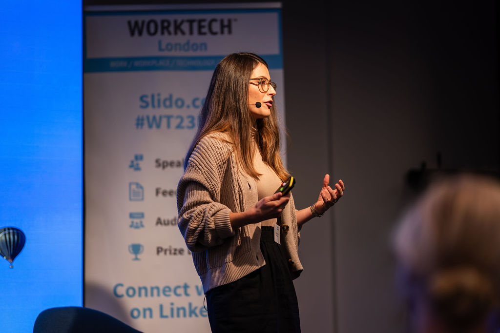A woman speaking at a conference